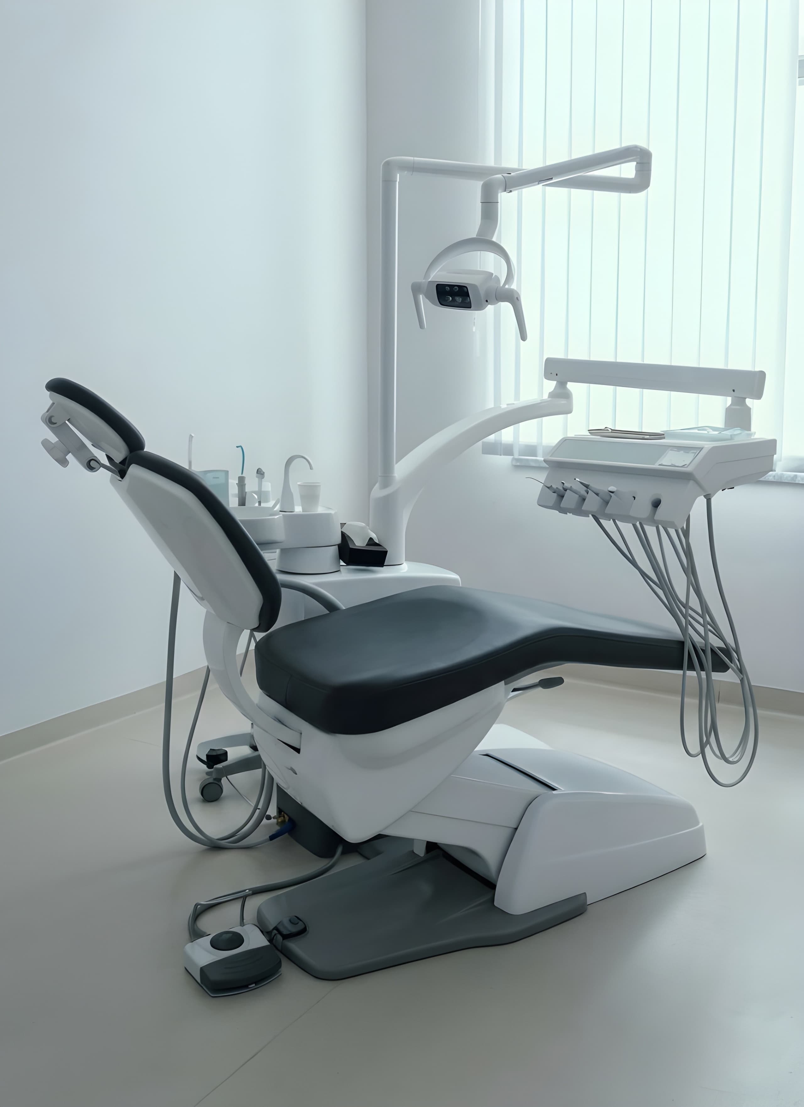 Modern dental treatment room with patient chair and equipment